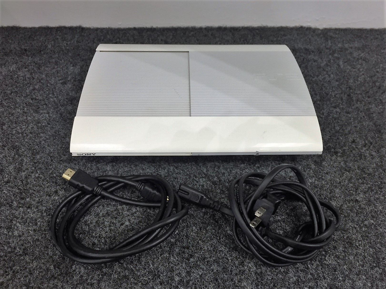 PS3 Slim 12Go + Disque Dur 500Go Intégré + 2 Manettes + 15 Jeux - Occasion